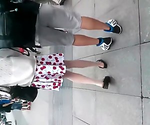 The Chinese hot teen in white stockings got upskirted